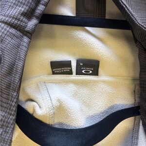 Oakley Gray Plaid Snowboard / Ski jacket. Lined waterproof. Never worn I think